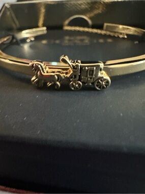 Coach Gold Tone Coach-and-Horse Bangle Bracelet
